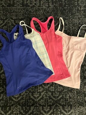 4 XS Women's athletic bra tanks. 3 Nike Dri-Fit, 1 OP